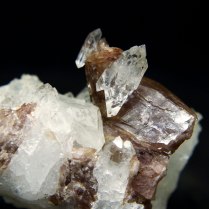 Axinite-(Fe) Ca2FeAl2BSi4O15OH with double terminated quartz SiO2; Skardu District, Baltistan, Gilgit-Baltistan, Pakistan; quartz crystal 14 x 7 x 7mm