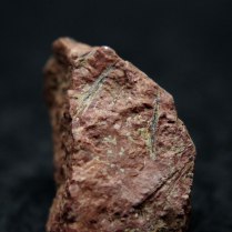 Zirconolite CaZrTi2O7 in microcline K(AlSi3O8); Skalna Brama pegmatite, Szklarska Poręba District, Karkonosze Mts (Karkonosze Massif), Lower Silesia (Dolnośląskie), Poland; 12mm (top crystal), 10mm (crystal in the middle), 7mm (bottom crystal)