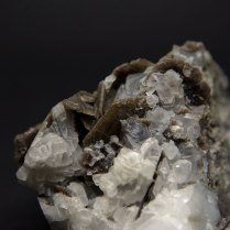 Axinite-(Fe) Ca2FeAl2BSi4O15OH with quartz SiO2; Zbraslav, Prague District (Praha District), Bohemia (Böhmen; Boehmen), Czech Republic; biggest crystal of axinite 17 mm