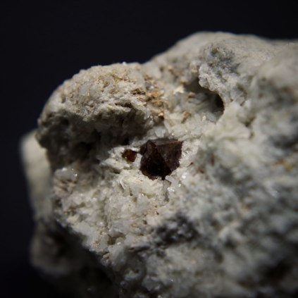 Zircon crystals Zr(SiO4) in albite Na(AlSi3O8); Pegmatite №24, Vavnbed Mt, Lovozero Massif, Kola Peninsula, Murmanskaja Oblast', Northern Region, Russia; biggest crystal 5 x 5 mm