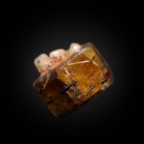 Complete hexagonal crystal of bastnäsite-(Ce) CeCO3F with inclusions of black aegirine NaFeSi2O6 and yellowish rutile TiO2; Zagi Mountain, Hameed Abad Kafoor Dheri, Peshawar, Khyber Pakhtunkhwa, Pakistan; crystal: 11 x 8 x 6 mm