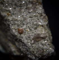 Short prismatic and striated cristal of synchysite-(Ce) CaCe(CO3)2F with smoky quartz SiO2 on gneiss; Mt. Cervandone area (Scherbadung; Cherbadung), Devero Alp, Baceno, Devero Valley, Antigorio Valley, Ossola Valley, Verbano-Cusio-Ossola Province, Piedmont, Italy; quartz crystal: 7 mm