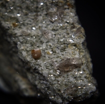Short prismatic and striated cristal of synchysite-(Ce) CaCe(CO3)2F with smoky quartz SiO2 on gneiss; Mt. Cervandone area (Scherbadung; Cherbadung), Devero Alp, Baceno, Devero Valley, Antigorio Valley, Ossola Valley, Verbano-Cusio-Ossola Province, Piedmont, Italy; quartz crystal: 7 mm