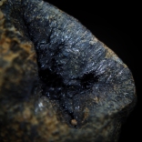 Acicular crystals of dark blue almost black vivianite Fe3(PO4)2•8H2O; San Giovanni Valdarno, Valdarno (Val d'Arno), Arezzo Province, Tuscany, Italy; FOV: 30 mm