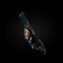 A superb small miniature with a perfect, glassy single crystal of green vivianite Fe3(PO4)2•8H2O of superb luster and clarity; Huanuni mine, Huanuni, Dalence Province, Oruro Department, Bolivia; 28 × 4 × 2 mm