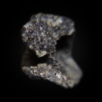 Platy crystals of greenish åkermanite Ca2Mg(Si2O7) in Venanzite; Vispi Quarry, San Venanzo, Terni Province, Umbria, Italy; 24 × 20 × 15 mm